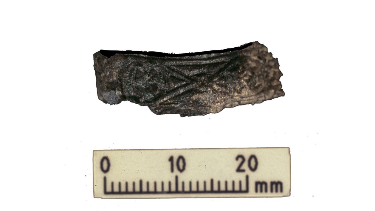 A decorated hilt guard from a Viking warrior's sword was also recovered from the same grave.