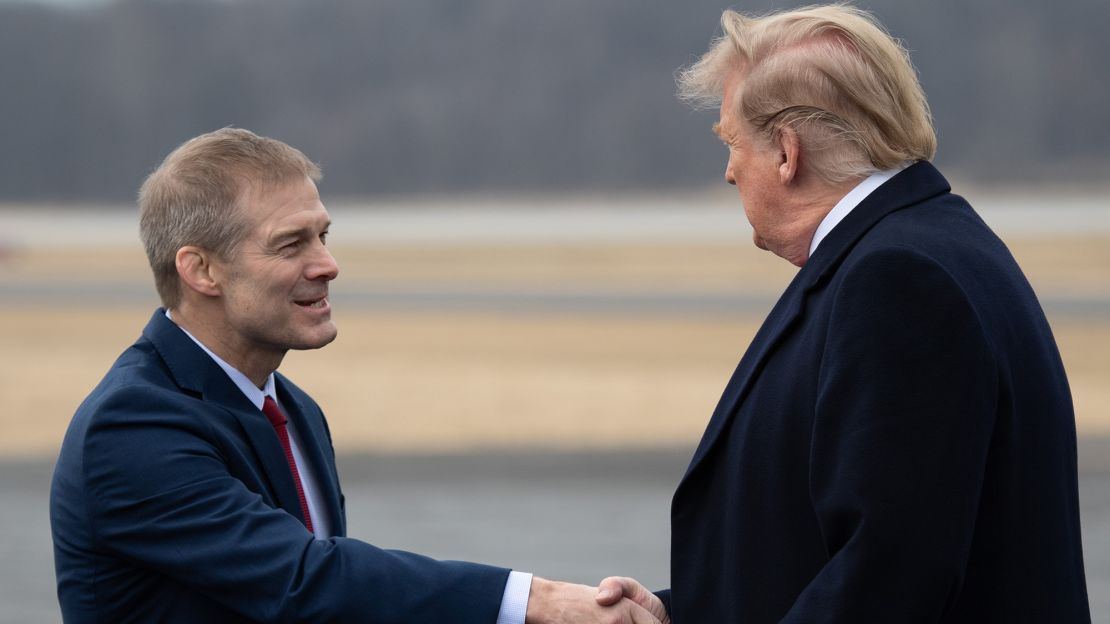 US President Donald Trump shakes hands with US Representative Jim Jordan, as he disembarks from Air Force One in Lima, Ohio, March 20, 2019.