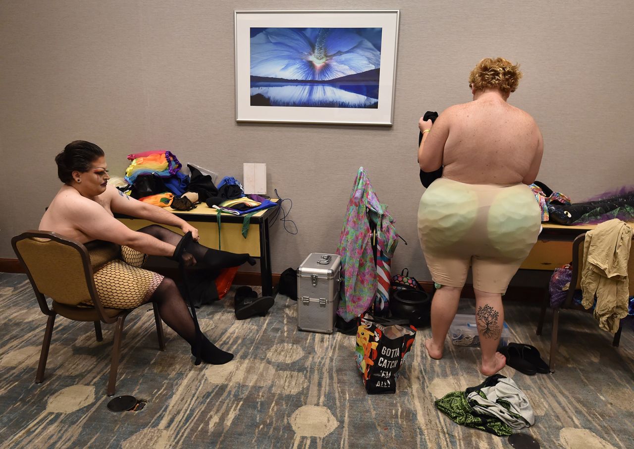 Drag queens dress using padding and stockings  prior to the NEPA PrideFest Royale drag pageant at the Hilton Conference Center in Scranton, Pennsylvania on June 25, 2022. 