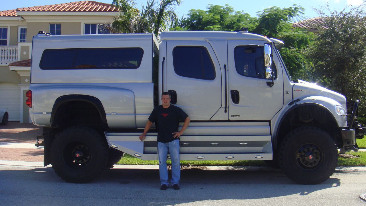 Chris George with his silver monster truck. The twins lived flamboyant lifestyles and owned boats, flashy watches and multiple homes.  