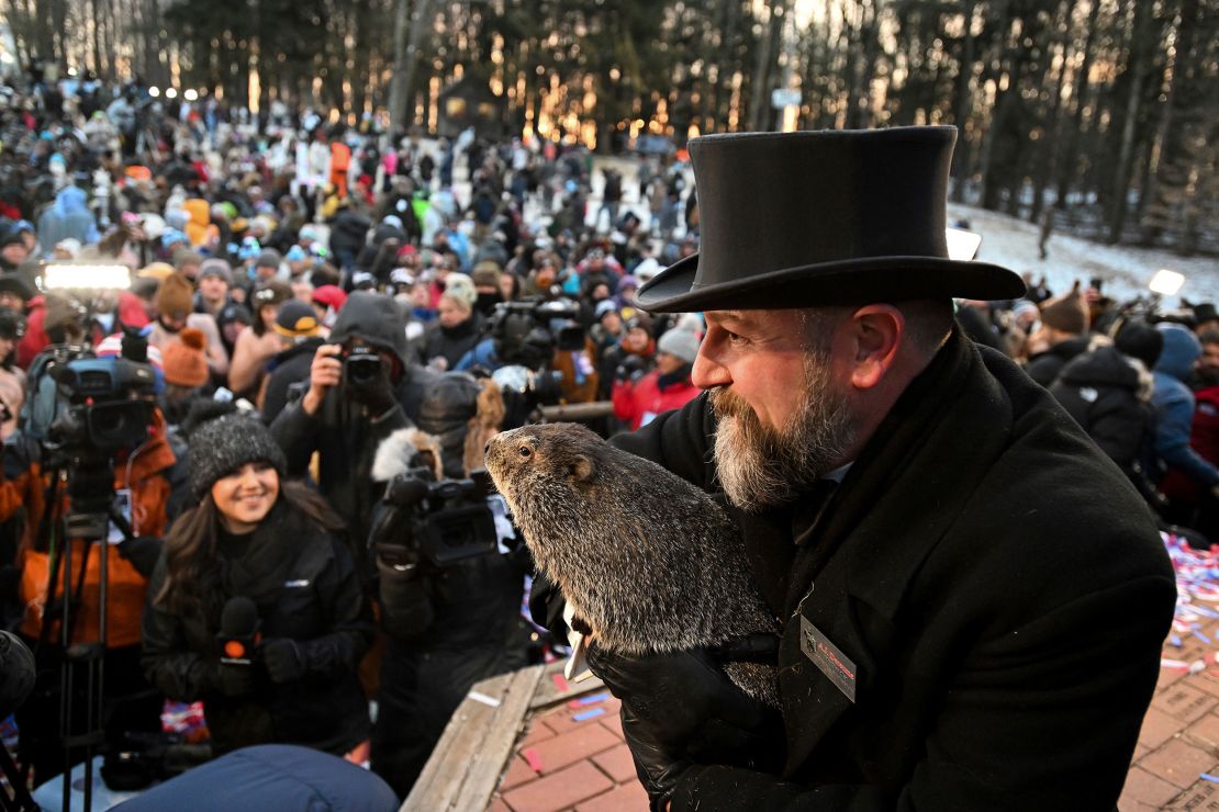 Groundhog Club handler A.J. Dereume holds Punxsutawney Phil during the celebration of Groundhog Day on Thursday in Punxsutawney, Pennsylvania.