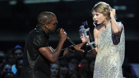 Kanye West jumps onstage as Taylor Swift accepts her award for the 