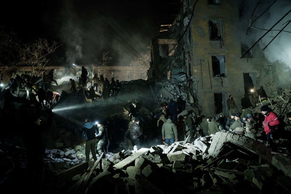 Emergency workers trawl the debris for survivors at a destroyed apartment building in downtown Kramatorsk on February 1, 2023.