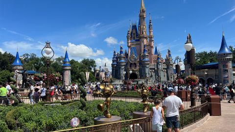 People gather ahead of the "Festival of Fantasy" parade at the Walt Disney World Magic Kingdom theme park in Orlando, Florida, U.S. July 30, 2022. 