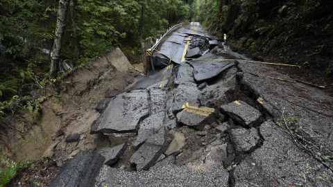 A road in in California's Santa Cruz Mountains was partially washed away by torrential rain caused by an atmospheric river. 