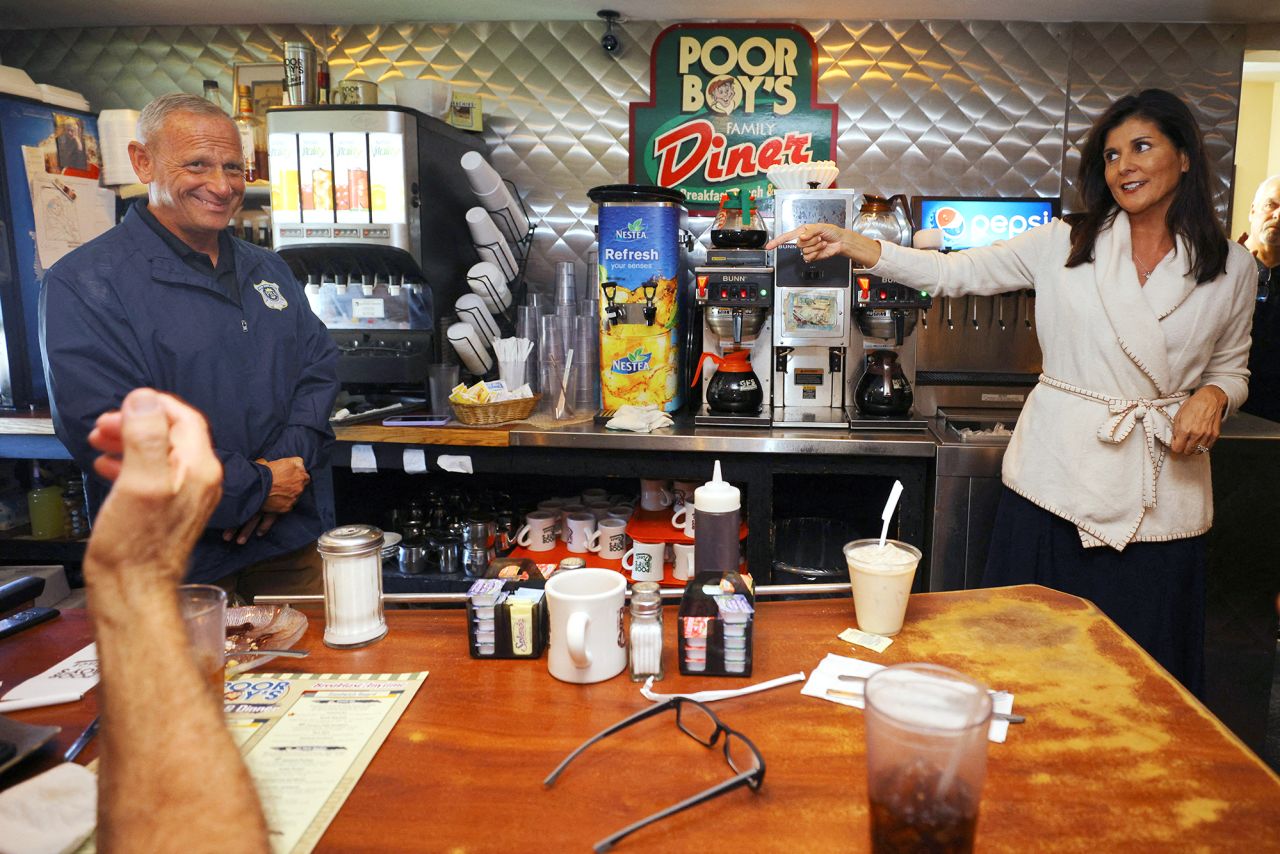 Haley campaigns with Republican Senate candidate Don Bolduc at a diner in Londonderry, New Hampshire, in September 2022. Haley joined several Senate candidates on the campaign trail during the 2022 midterm election season.