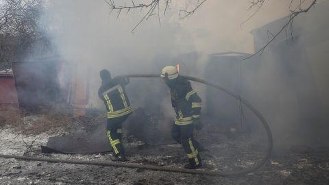 Rescuers work at the site of a Russian missile strike Thursday in Kramatorsk.