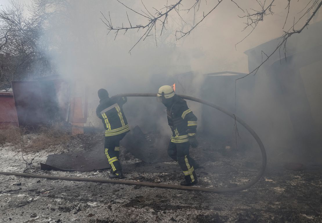 Rescuers work at the site of a Russian missile strike Thursday in Kramatorsk.
