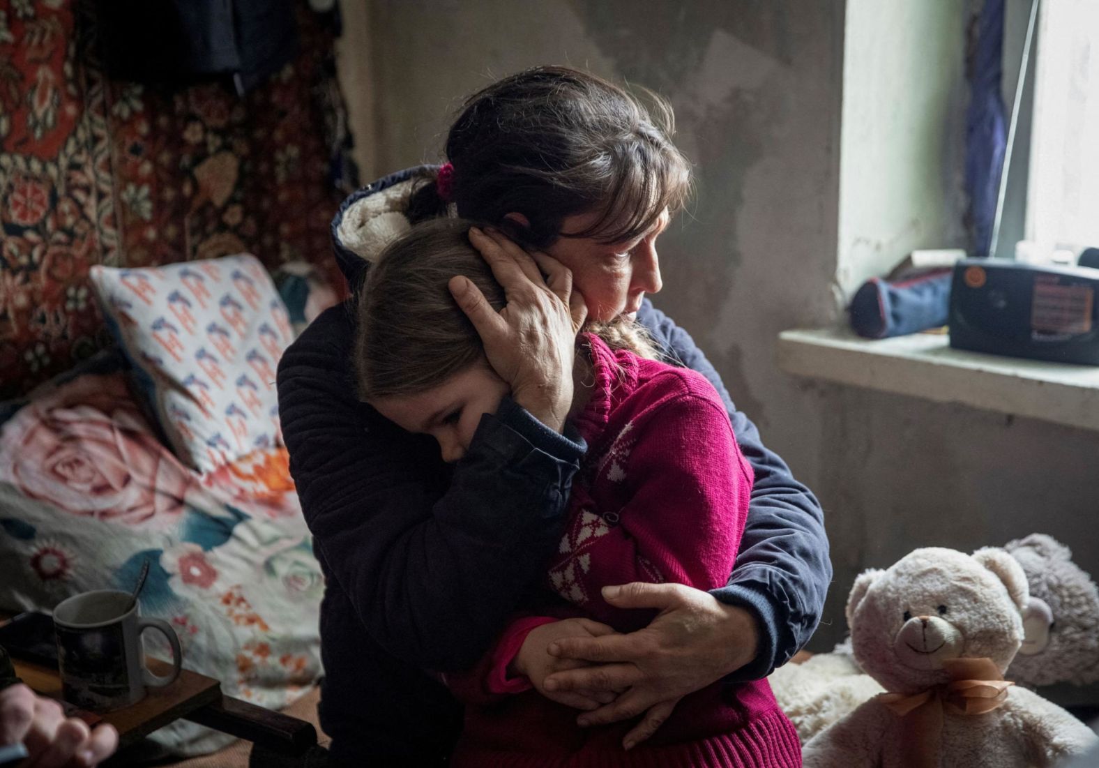 A woman named Olha hugs her 6-year-old granddaughter, Arina, and says goodbye before evacuating the Ukrainian city of Bakhmut on Tuesday, January 31. During Russia's war on Ukraine, <a href="index.php?page=&url=https%3A%2F%2Fwww.cnn.com%2F2022%2F12%2F22%2Feurope%2Fukraine-zelensky-bakhmut-us-congress-intl%2Findex.html" target="_blank">the city of Bakhmut</a> has been regularly referred to as the most contested and kinetic part of the front line.