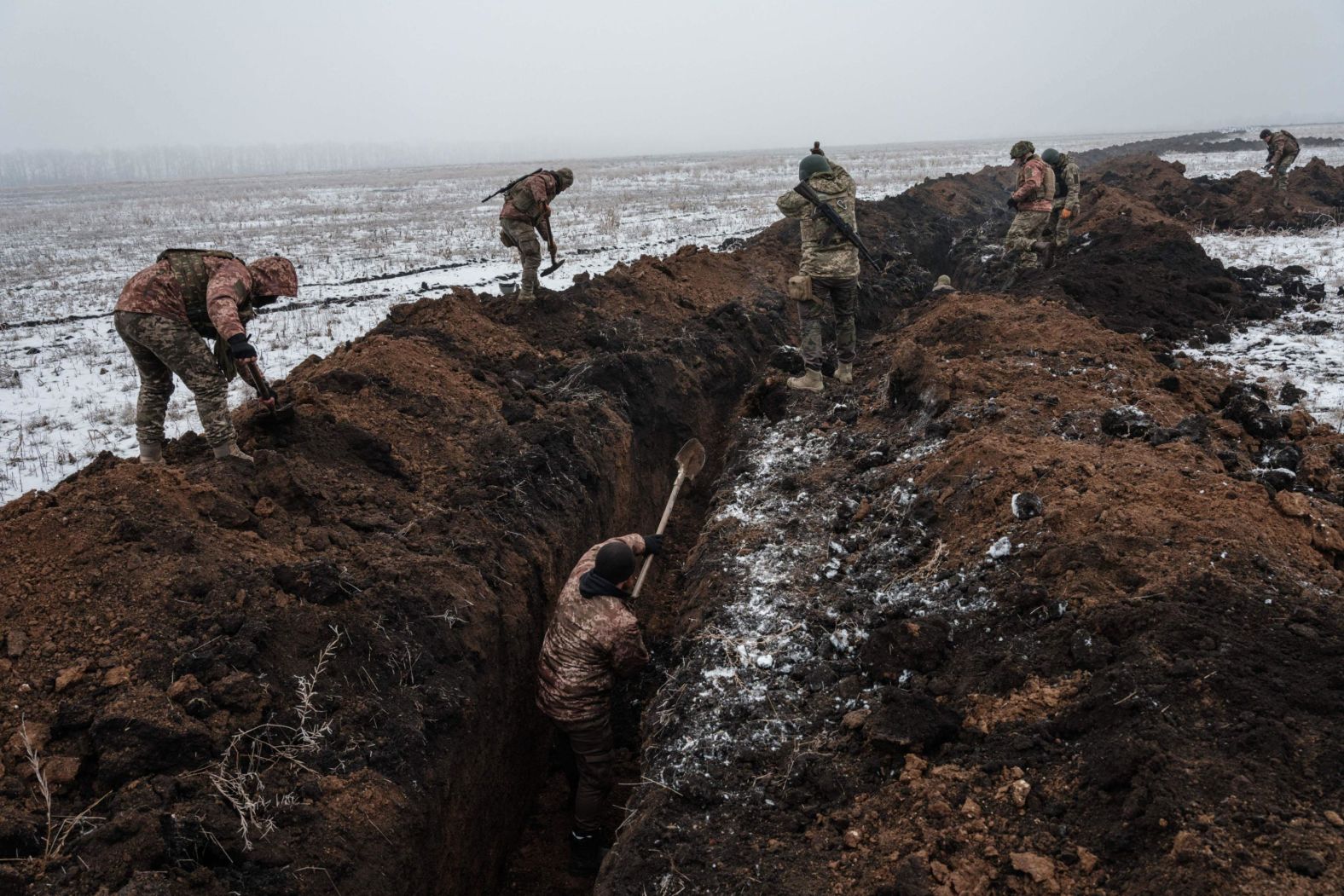 Ukrainian servicemen make a trench near the city of Bakhmut on Wednesday, February 1.