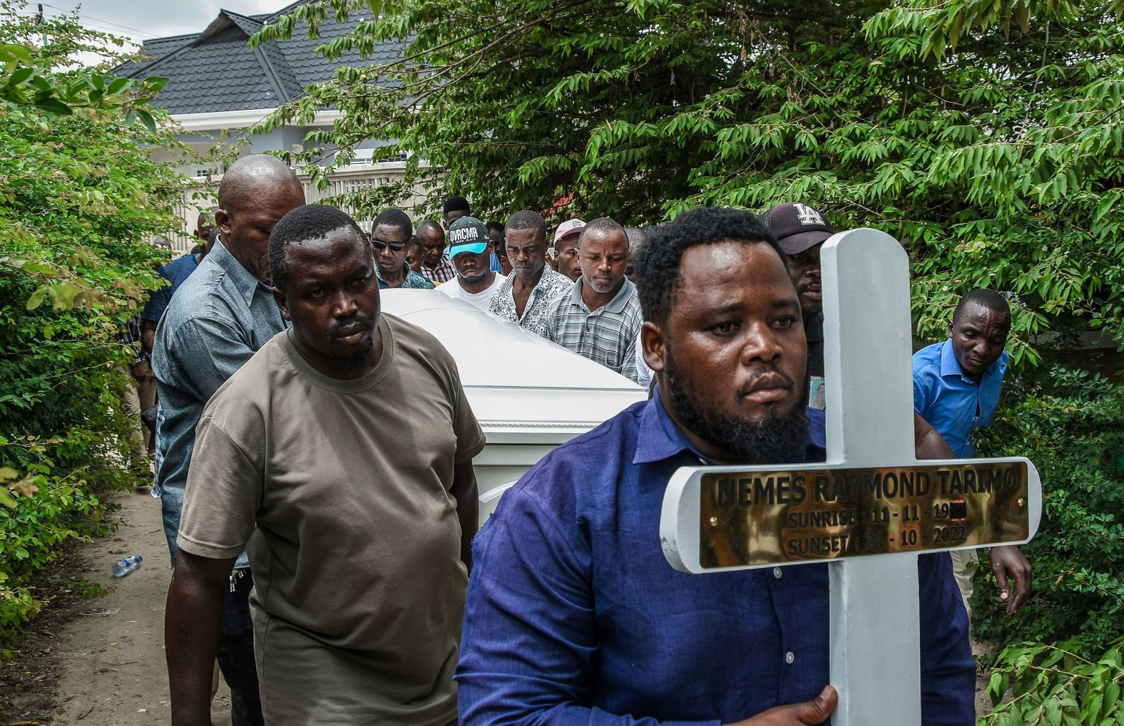Mourners in Dar es Salaam, Tanzania, carry the body of Nemes Tarimo, a Tanzanian national who was killed fighting for Russia in Ukraine, during a funeral ceremony on Friday, January 27. <a href="index.php?page=&url=https%3A%2F%2Fwww.cnn.com%2F2023%2F01%2F25%2Fafrica%2Flemekani-nyirenda-buried-zambia-intl%2Findex.html" target="_blank">Tarimo was killed in October</a> while fighting with the Russian mercenary group Wagner in exchange for money and amnesty, his country's foreign ministry said in a statement. The ministry said Tarimo was studying in Moscow before he was sent to jail on undisclosed criminal charges.