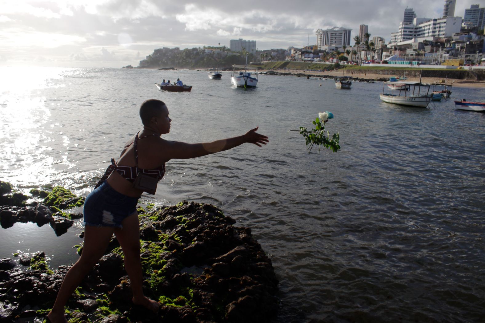 A devotee in Salvador, Brazil, throws flowers as offerings to the sea goddess Iemanjá on Wednesday, February 1. Iemanjá is revered across many faiths in Brazil. <a href="index.php?page=&url=http%3A%2F%2Fwww.cnn.com%2F2023%2F01%2F26%2Fworld%2Fgallery%2Fphotos-this-week-january-19-january-26%2Findex.html" target="_blank">See last week in 33 photos</a>.
