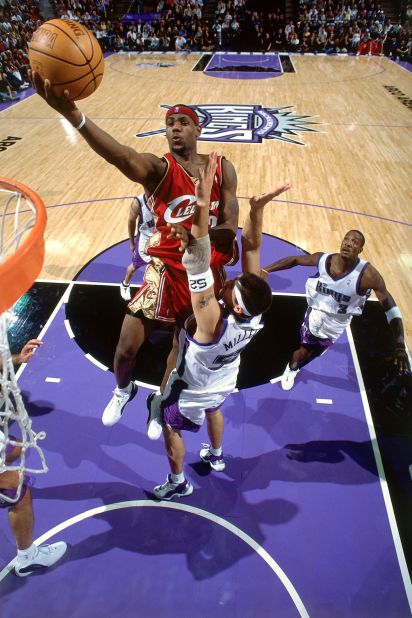 James goes up for a layup during his NBA debut on October 29, 2003. He scored 25 points in a loss at Sacramento. In his first season in the NBA, James won the league's Rookie of the Year Award.