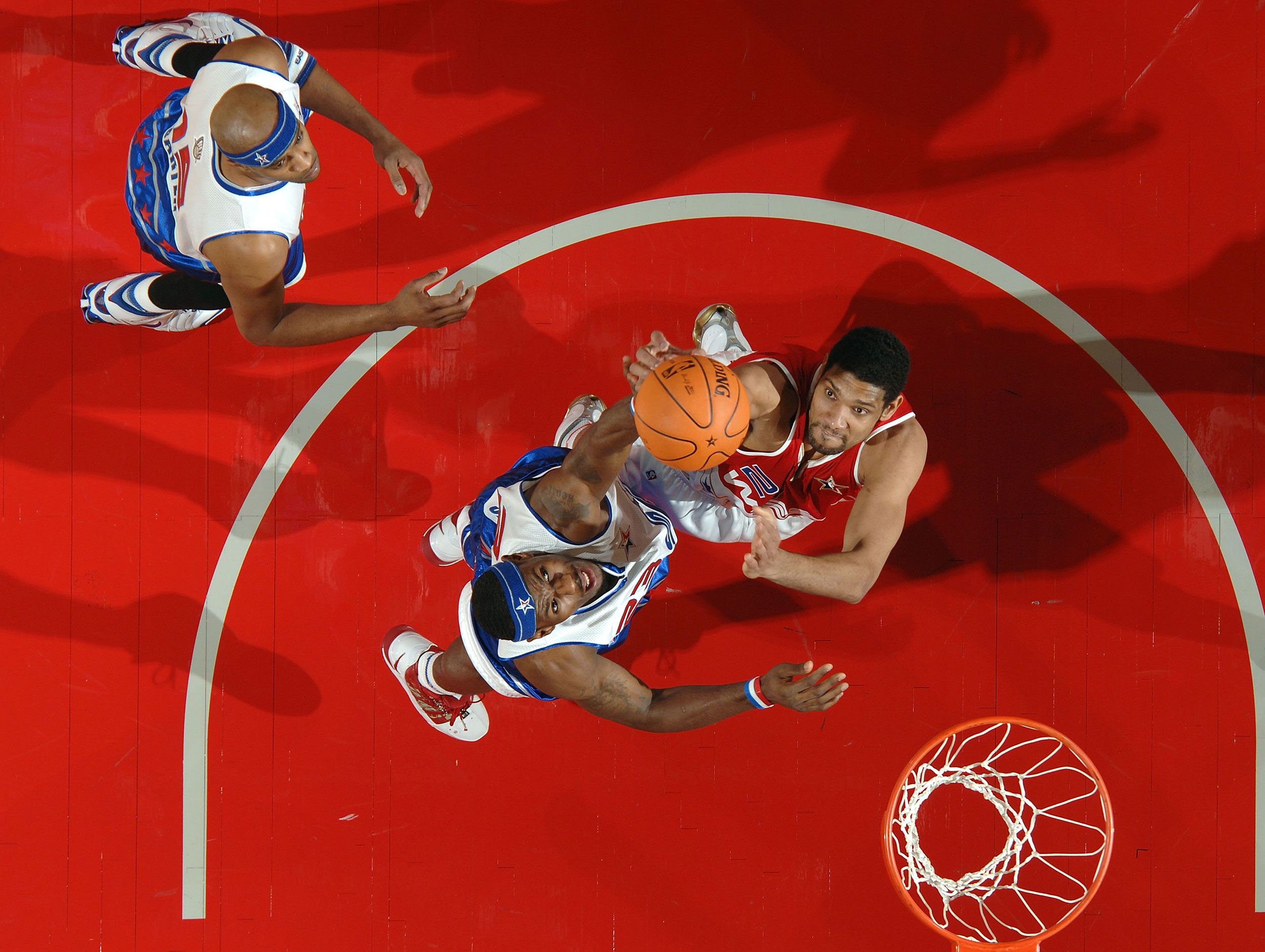 James, center, goes up for a rebound during the 2006 NBA All-Star Game.