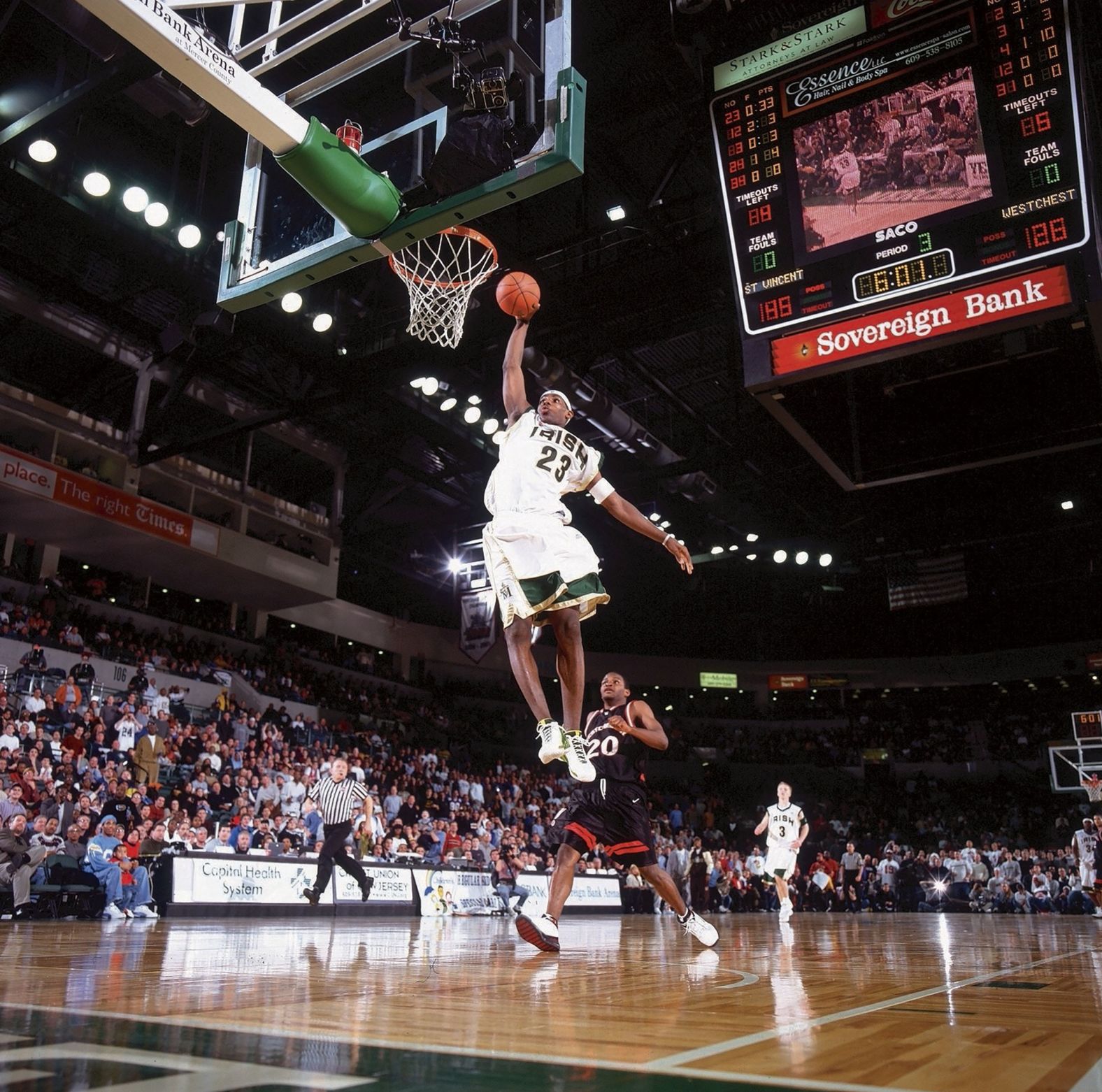 James throws down a dunk during a game in Trenton, New Jersey, in February 2003. James was just a junior in high school when he appeared on the cover of Sports Illustrated as "The Chosen One." He was such a star that ESPN aired some of his high school games.