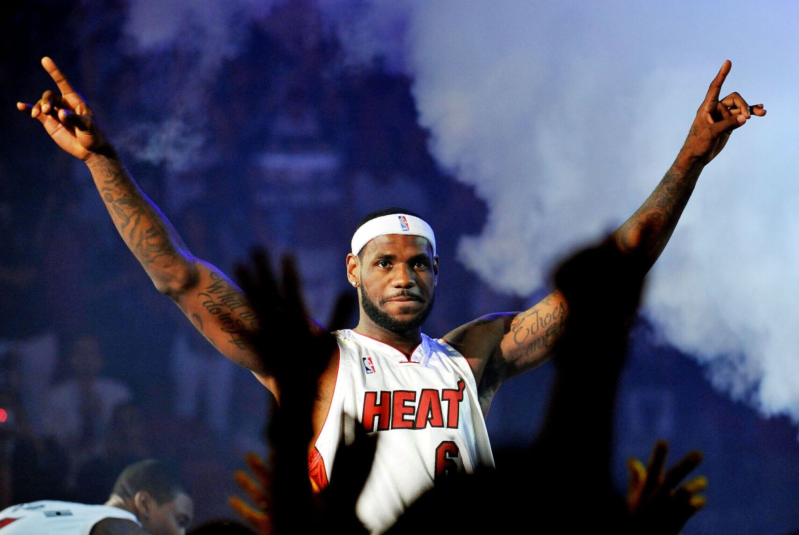 James greets Miami fans during a pep rally at the American Airlines Arena in July 2010. He was joined by Dwayne Wade and Chris Bosh, the other two stars in the Heat's "Big 3" superteam. During the event, James boasted about how many titles they would win together.