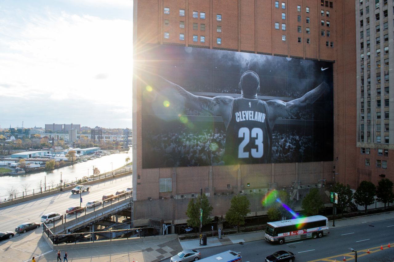 James appears on a Nike poster outside Cleveland's Quicken Loans Arena in October 2014, a few months after he announced that he would be returning to the Cavaliers as a free agent.