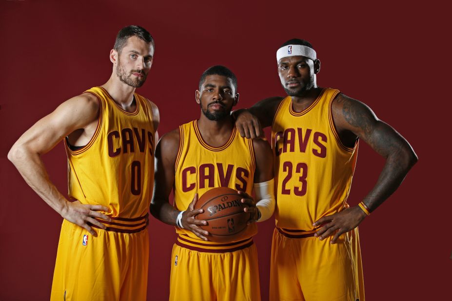 James poses with his new "Big 3" in Cleveland: Kevin Love, left, and Kyrie Irving.