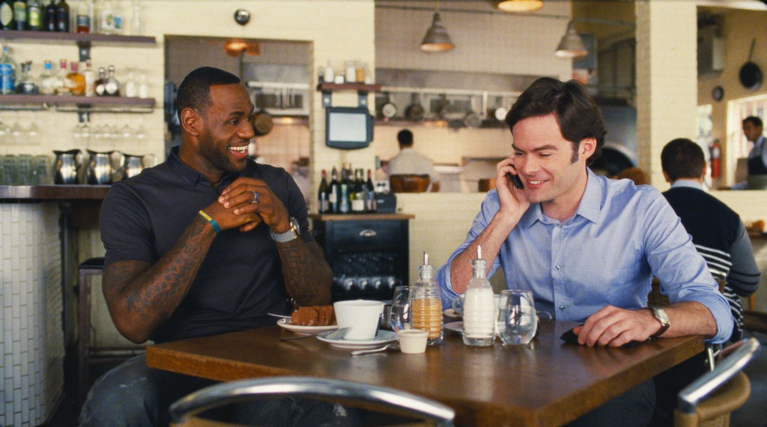 James appears as himself in the 2015 comedic film "Trainwreck" starring Bill Hader, right, and Amy Schumer.