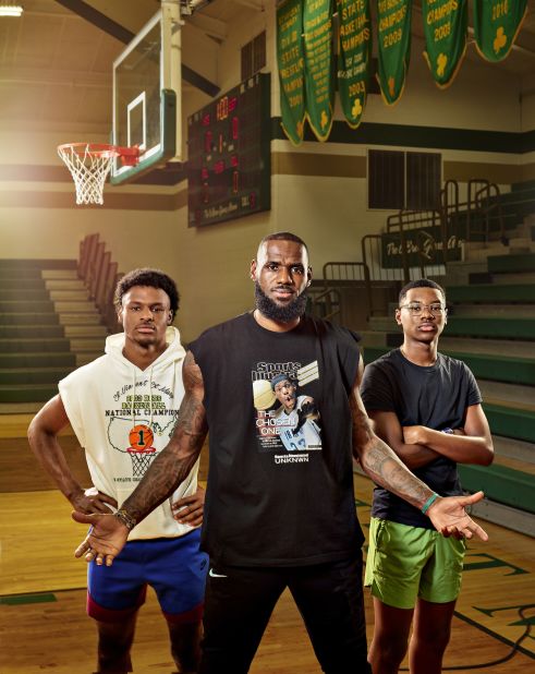 James poses with his two sons — Bronny, left, and Bryce — at his former high school in Akron in July 2022. Bronny is one of the best high school players in the country, and his dad said he wants to finish his career by playing with him in the NBA.