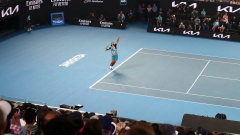 Australian player Nick Kyrgios serves in a charity match against Serbian Novak Djokovic ahead of the Australian Open at Melbourne Park on January 13, 2023.