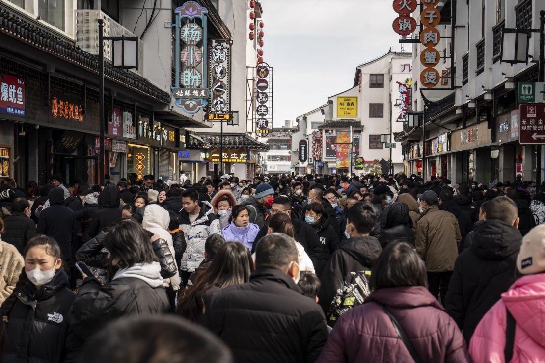 Shoppers in the Guanqian Street shopping area in Suzhou, Jiangsu province, on January 25, 2023. 