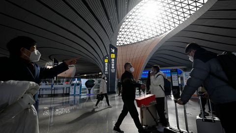 Passengers prepare to check in at Daxing International airport in Beijing on January 19, 2023.