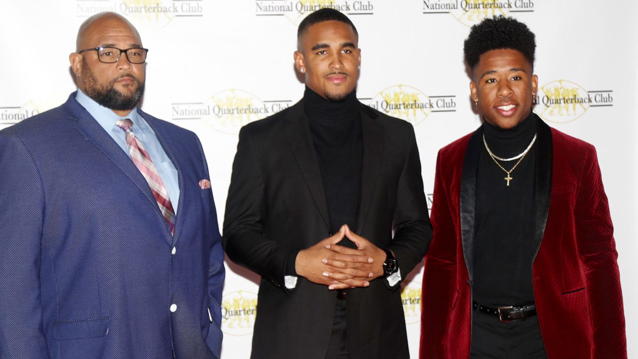 Hurts stands with his father Averion (left) and his brother Averion Jr. (right) during his time with Oklahoma before the National Quarterback Club Awards Dinner & Hall of Fame Induction Ceremony The Scottsdale Resort at McCormick Ranch in Scottsdale, Ariz. on January 19, 2019.