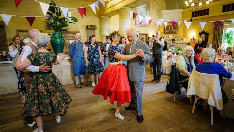 Charles gets involved during a tea dance hosted by The Prince's Foundation to mark the Queen's Platinum Jubilee, at Highgrove, near Tetbury, western England on May 31, 2022. 
