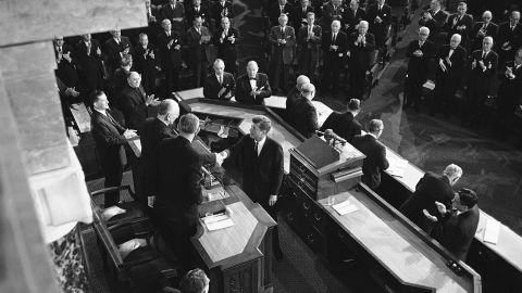 President Kennedy shakes hands with House Speaker John McCormack, D-Mass., on Jan. 11, 1962 in Washington after delivering his State of the Union address to a joint session of the 87th Congress in the House chamber. Beside McCormack is Vice President Lyndon Johnson. (AP Photo)