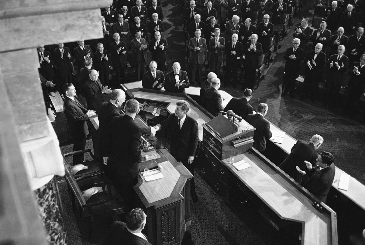 President John F. Kennedy shakes hands with House Speaker John McCormack in 1962.