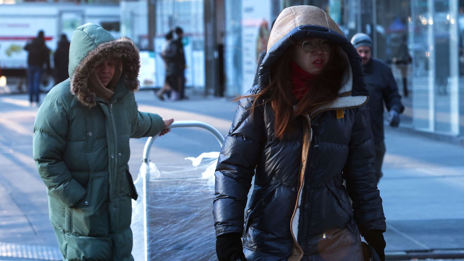 People bundled up against winter weather as they made their way through midtown Manhattan Friday, February 3, while bitter cold temperatures moved into much of the Northeast.