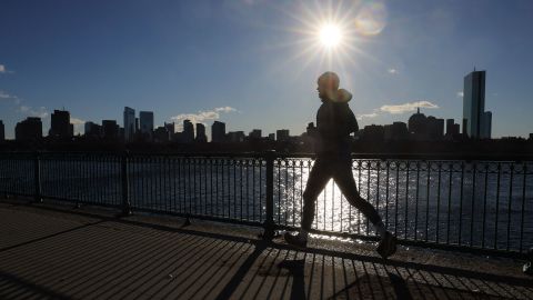 A jogger ran along the Charles River, within view of the Boston skyline, on a cold winter morning in Cambridge, Massachusetts, on February 3.