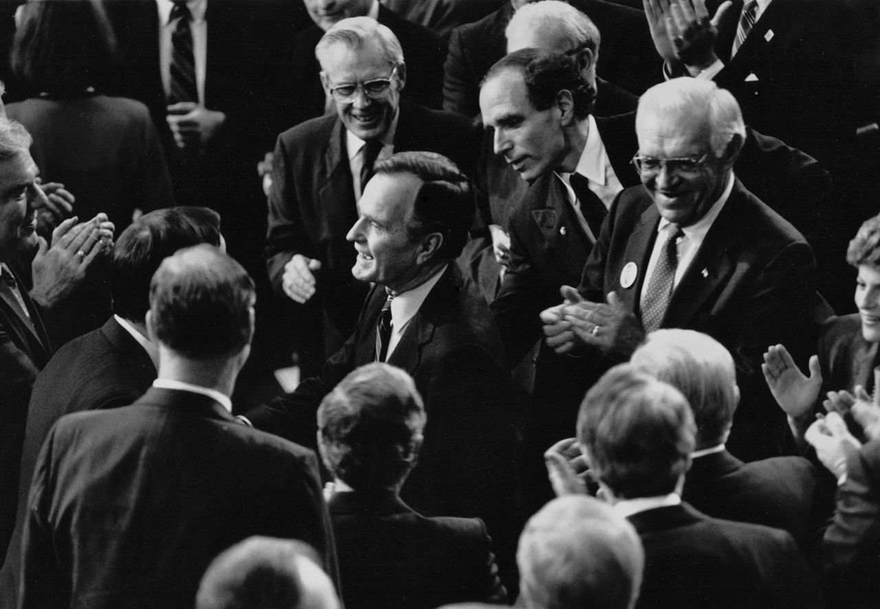 President George H.W. Bush speaks with lawmakers following his 1991 State of the Union. 