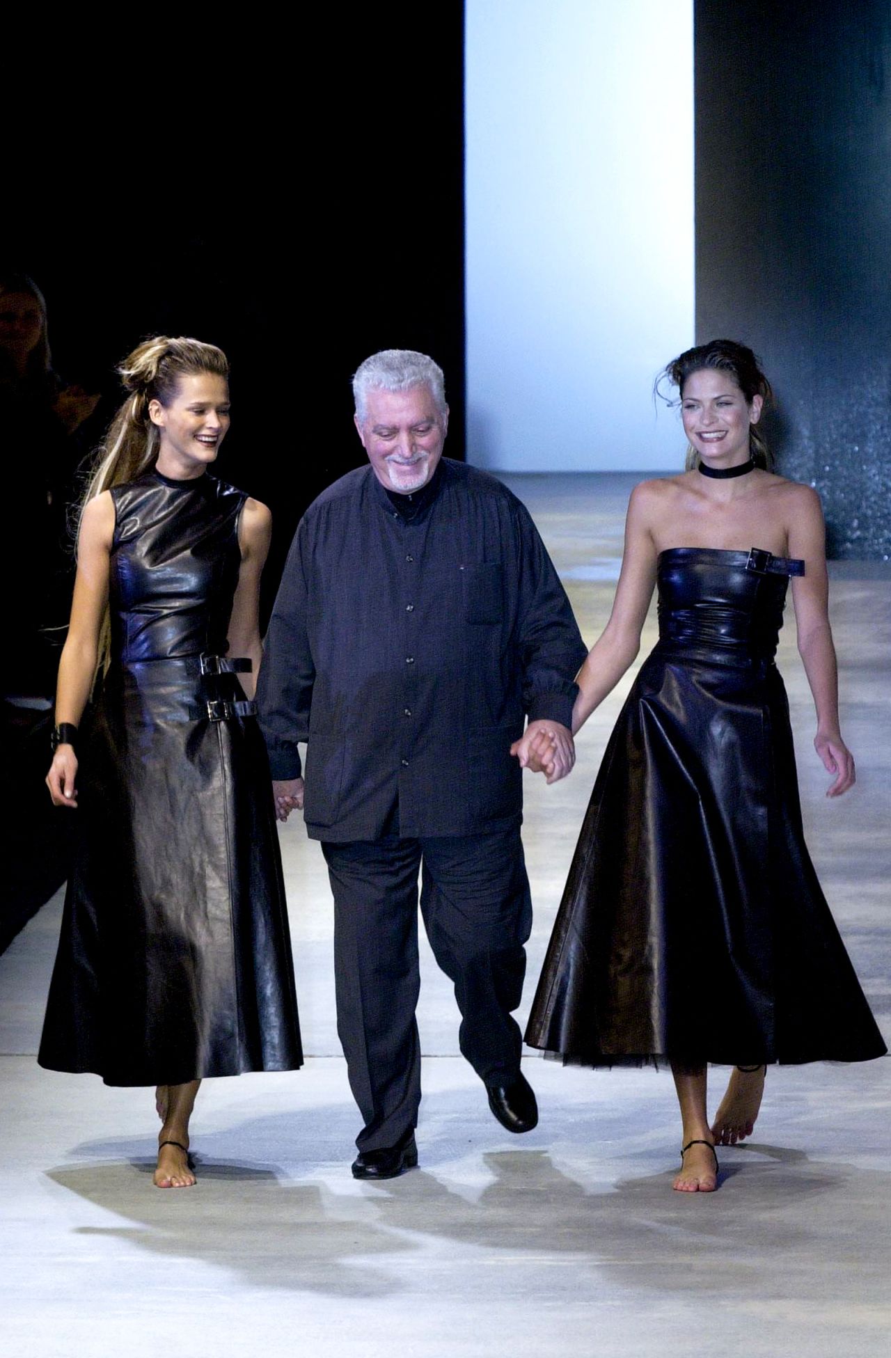 Paco Rabanne with models Carmen Kass and Mini Anden at Paris Fashion Week in 2000.
