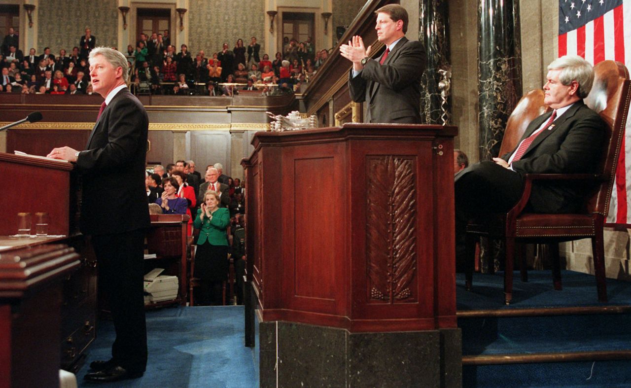Vice President Al Gore, flanked by House Speaker Newt Gingrich, stands to applaud during President <a href="https://www.cnn.com/2014/10/04/politics/gallery/bill-clinton/index.html" target="_blank">Bill Clinton</a>'s 1996 address. Clinton called for an "end to big government" after a 27-day government shutdown.