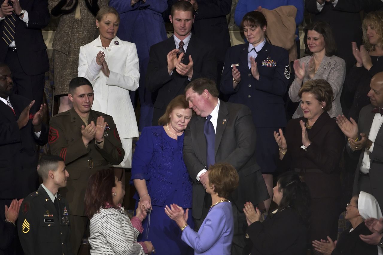 Janet and William Norwood hold each other during applause after being acknowledge during Bush's 2005 State of the Union. The Norwood's son, Marine Corps Sergeant Byron Norwood, was killed in Iraq.