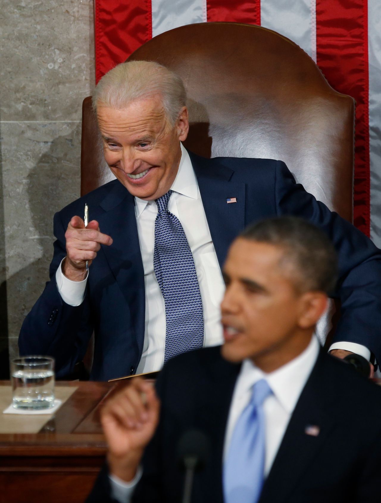 Vice President Joe Biden points and laughs as Obama gives his 2014 address. The "finger guns" image quickly became a meme.