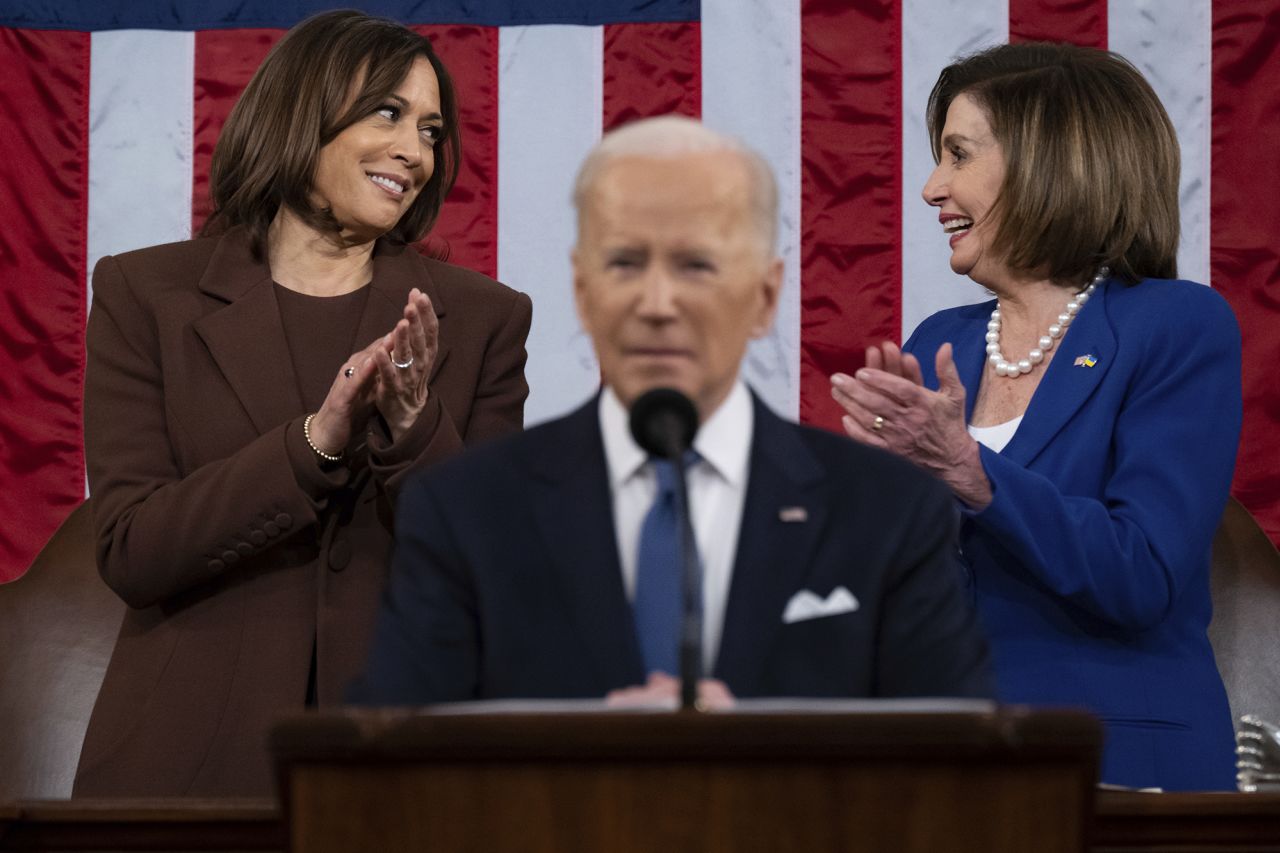 Vice President <a href="https://www.cnn.com/2021/01/08/politics/gallery/kamala-harris/index.html" target="_blank">Kamala Harris</a>, left, and <a href="https://www.cnn.com/2022/11/17/politics/gallery/nancy-pelosi/index.html" target="_blank">Pelosi</a> smile at each other during Biden's address in 2022. It was the first time in history that two women were seated behind the president during a formal State of the Union.
