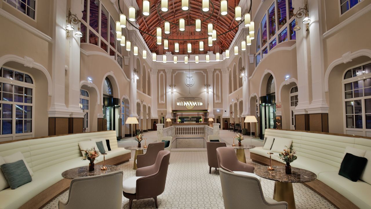 A recent photograph of the now transformed ticket hall, which acts as the hotel lobby.