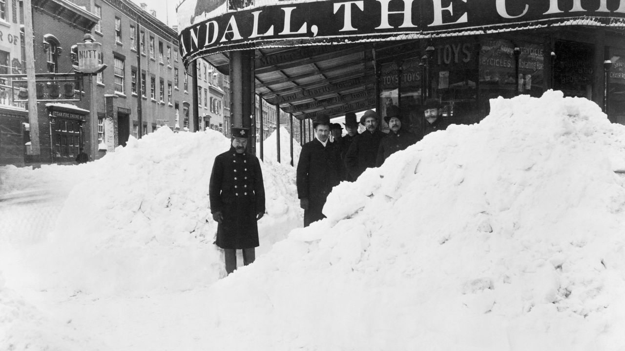 Snow is piled up in front of a New York store during the Blizzard of 1888.