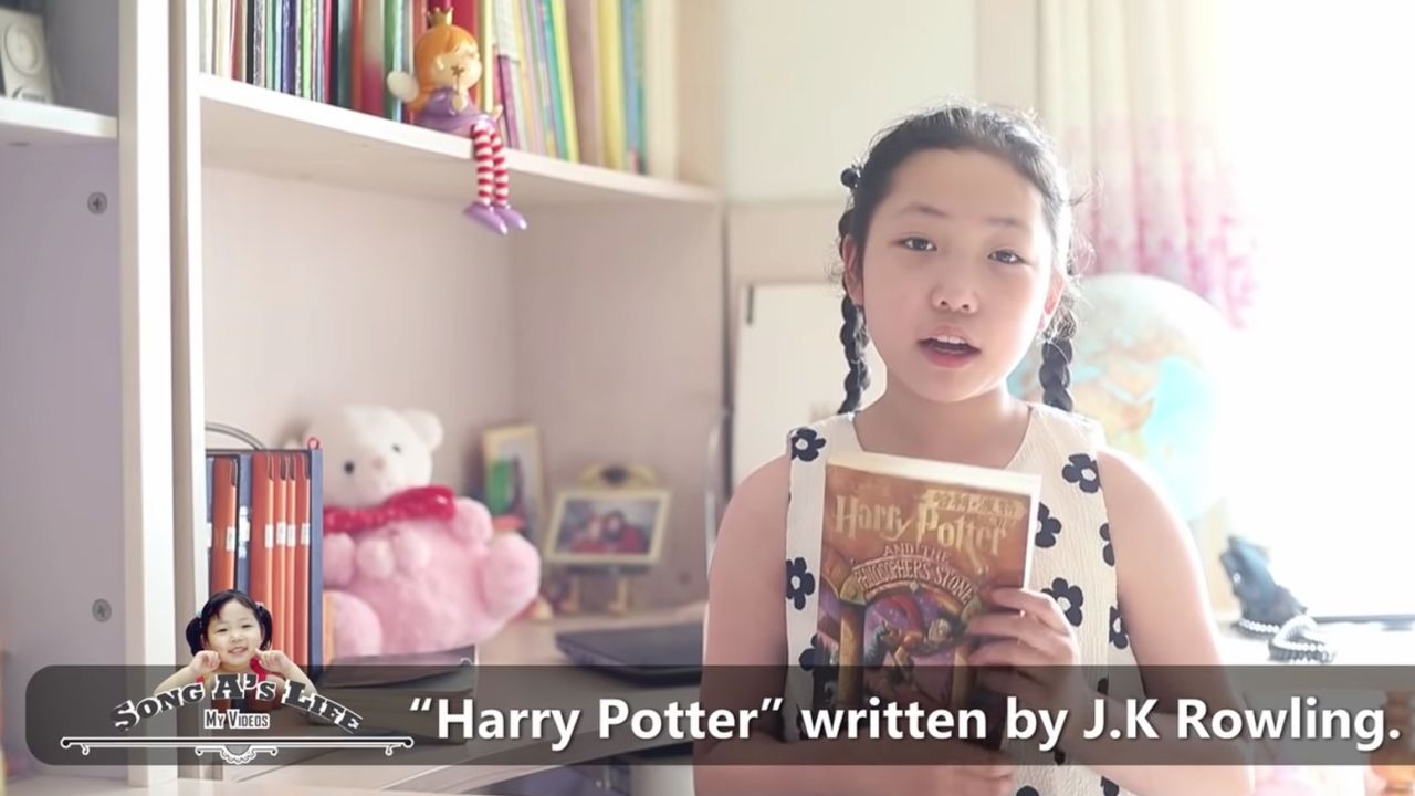 Song A, purportedly a resident of Pyongyang, North Korea, holds up a Harry Potter book in a YouTube video uploaded April 26, 2022.