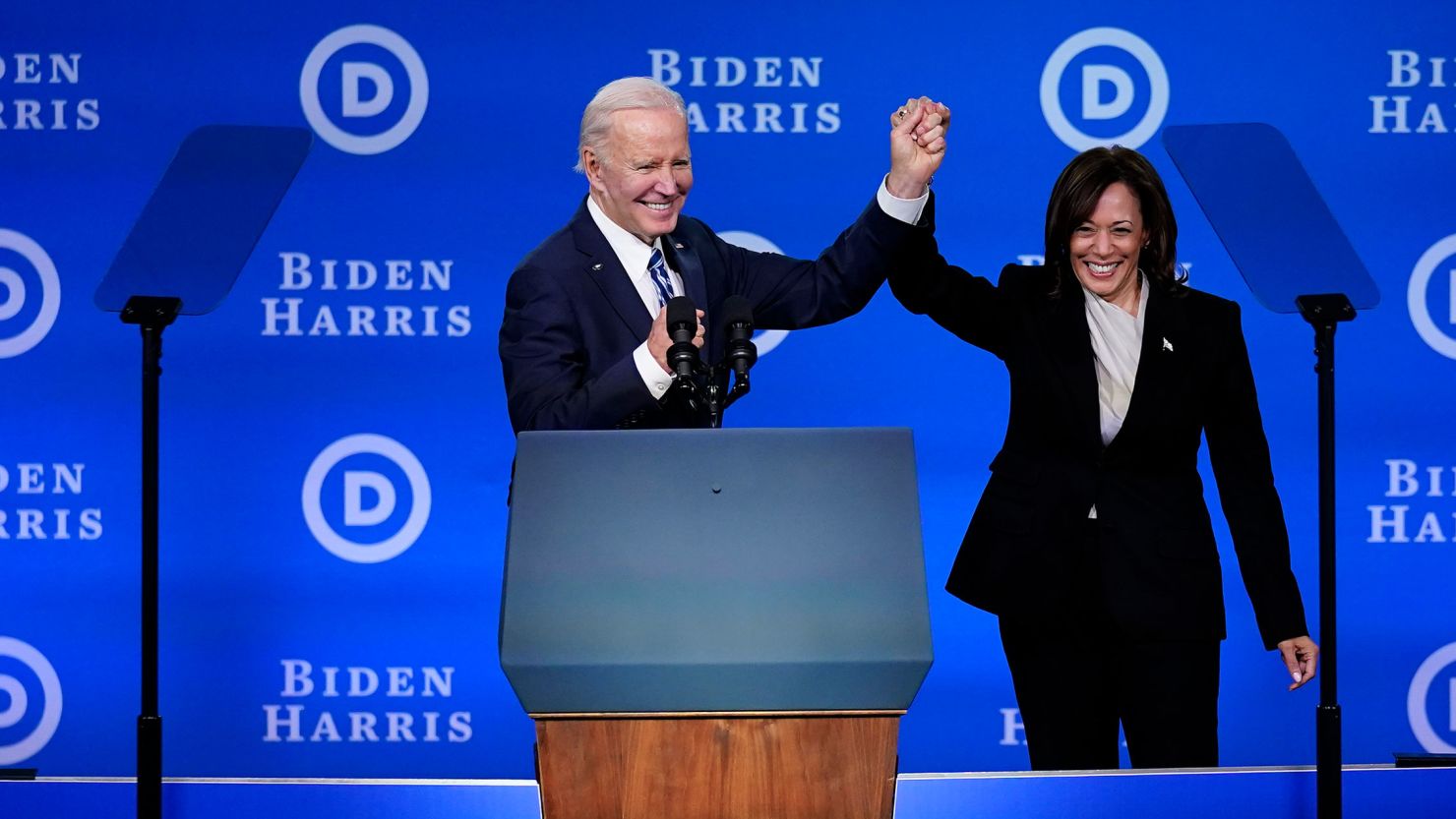 President Joe Biden and Vice President Kamala Harris hold their hands up at the Democratic National Committee winter meeting, February 3, 2023, in Philadelphia.