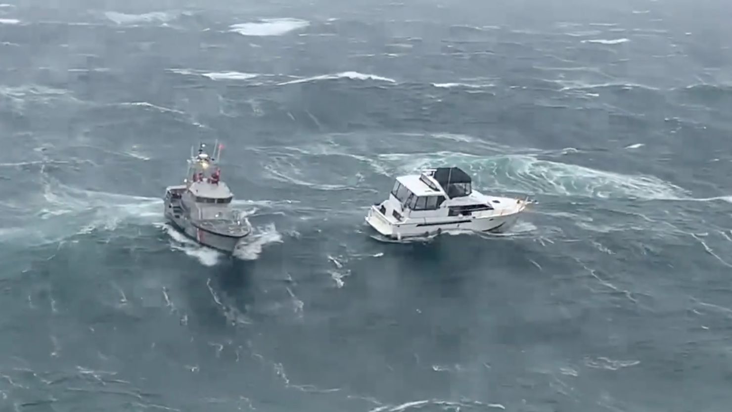 Coast Guard video from the rescue shows the vessel, at right, in distress. 