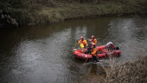 A search dog from Lancashire Police and a crew from Lancashire Fire and Rescue service search the River Wyre for missing woman Nicola Bulley.
