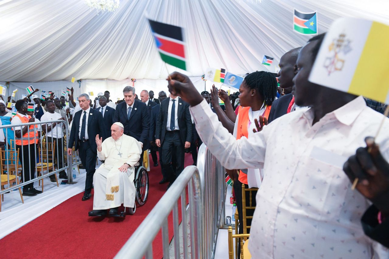 Attendees cheer as Pope Francis arrives for a meeting at the Freedom Hall in Juba, South Sudan, on February 4.