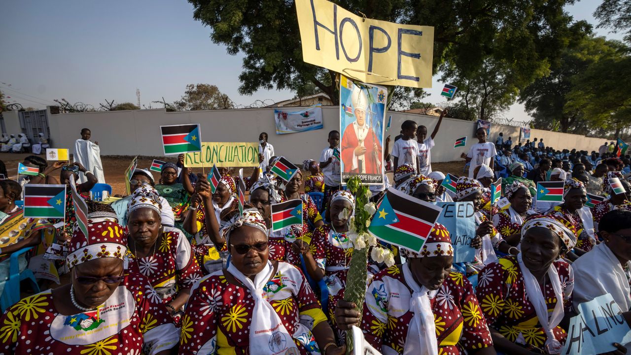 The public welcomed the Pope with national flags and peace banners at the St. Theresa Cathedral in Juba on Saturday.