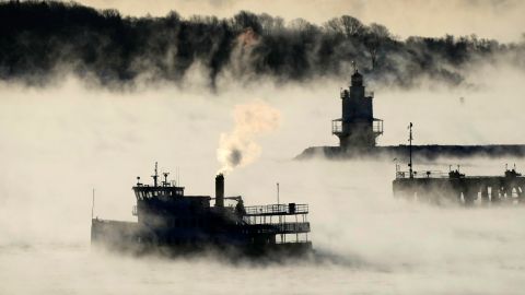 Arctic sea smoke rises from the the Atlantic Ocean as a passenger ferry passes Spring Point Ledge Light, Saturday, Feb. 4, 2023, off the coast of South Portland, Maine. The morning temperature was about -10 degrees Fahrenheit. 