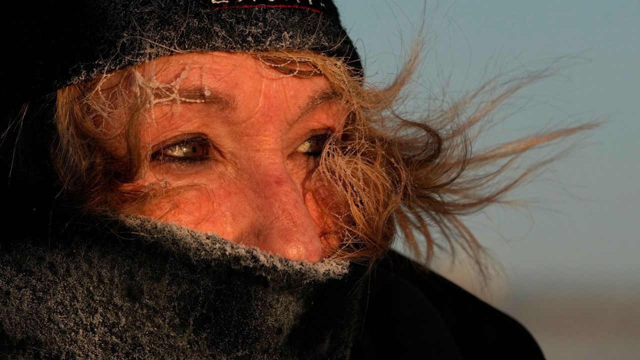 Frost clings to the hair of Joyce Love as she looks at arctic sea smoke on the coast of South Portland, Maine, Saturday, Feb. 4, 2023. The morning temperature was about minus 10 degrees Fahrenheit. 