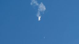 A jet flies by a suspected Chinese spy balloon after shooting it down off the coast in Surfside Beach, South Carolina, U.S. February 4, 2023. REUTERS/Randall Hill